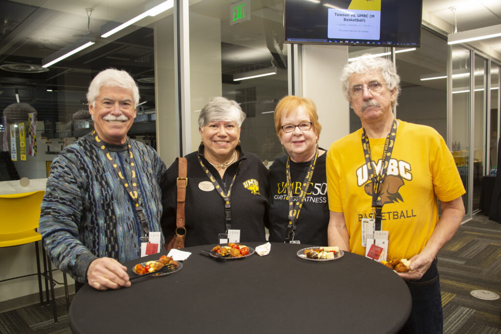 Mimi Dietrich ‘70 (third from left) enjoys cheering on the Retrievers in her black and gold. Photo courtesy of Josh Sinn ‘13.
